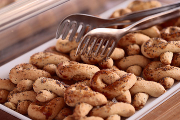 Image of pastry on the buffet. The concept of food and service in the hotel. Cropped shot, blurred, close-up, horizontal.