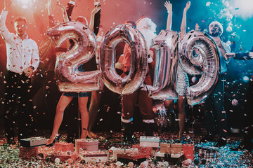 Smiling People with Baloons Celebrating New Year.