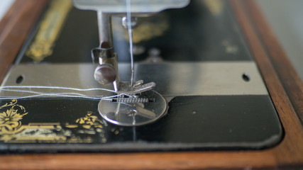 Foot of antique manual Sewing Machine, close up, selected focus.