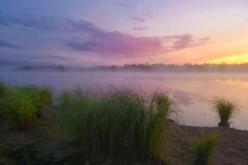 Fototapeta na wymiar Foggy sunrise on the Tunguska river. Jewish Autonomous region, far East, Russia. 