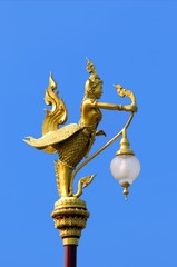 Fototapeta na wymiar Thai traditional lamp post on street in Thailand, Kinnaree lamp