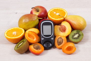Glucose meter for checking sugar level and nutritious fruits as healthy dessert for diabetics