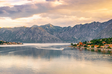 Kotor Bay in Montenegro before beautiful sunrise with small villages and the calm water
