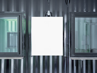 Blank white mock up poster frame on shipping container wall building with window glass.