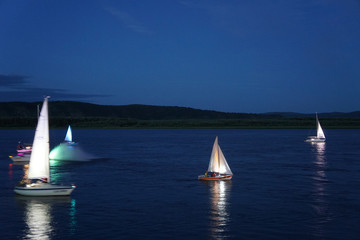sailing boat in rifer at sunset