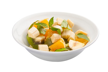 Breakfast. Fruit salad with banana and avocado. On a white background