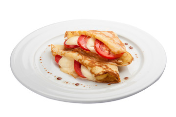 Breakfast. Pancakes with mozzarella and tomatoes. On a white background