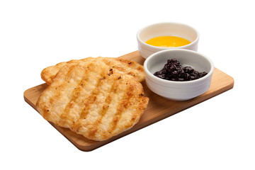 Breakfast. Puff cakes with honey and jam. On a white background