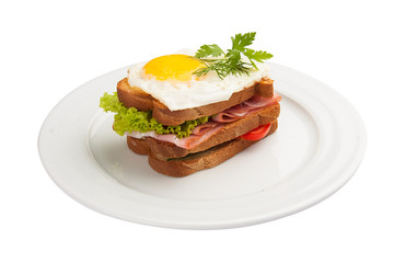 Breakfast. Sandwich with egg, ham and tomato. On a white background