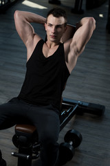 Attractive Young Man Resting In Gym Afther Exercise