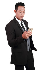 portrait of businessman holding cell phone on isolated background