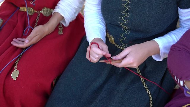 Handmade Genoese Paracord Buckle Bracelet. Young girls in historical medieval dresses