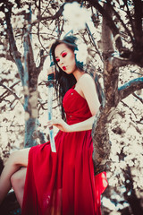 Asian woman in beautiful red dress