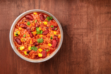 Chili con carne, traditional Mexican dish, overhead photo with a place for text