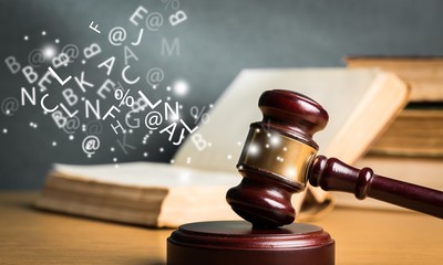 Wooden gavel with book close up