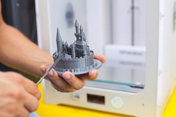 Modern three dimensional printer during work.