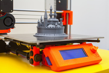 Modern three dimensional printer during work.