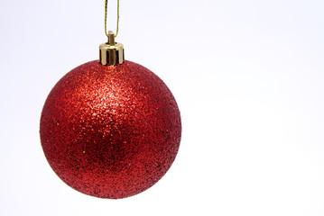 Christmas ball red on white background close-up