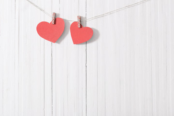 red paper heart on wooden background