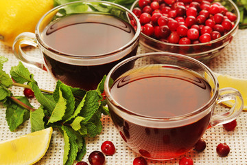 Hot tea with lemons, mint and cranberry