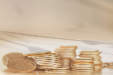 Double exposure Rows of coins of Clock on the table,finance and business concept,Money,soft focus and blurred style,dark tone.