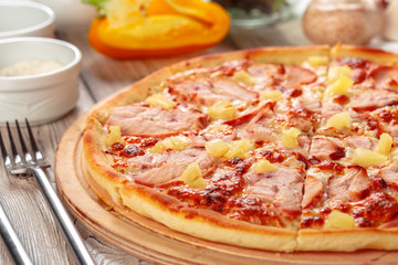 Delicious fresh pizza served on wooden table