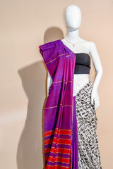 A traditional indian silk saree displayed for sale