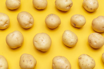 Potato on a colored background. Pattern of potato.