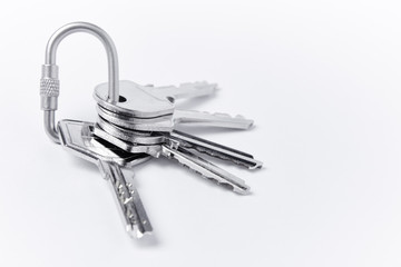 Key ring with keys over white background. Rent