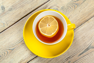 Cup of tea with lemon on table