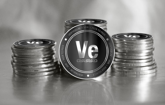 Veritaseum (VERI) digital crypto currency. Stack of black and silver coins. Cyber money.