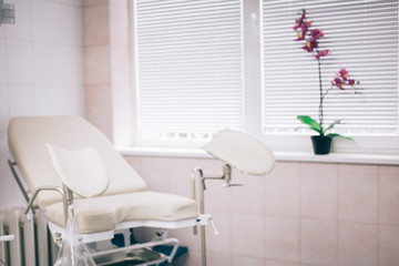 Fyazino, Russia - 06 11 2018: gynecological chair in the doctor's office, Orchid flower. women's...