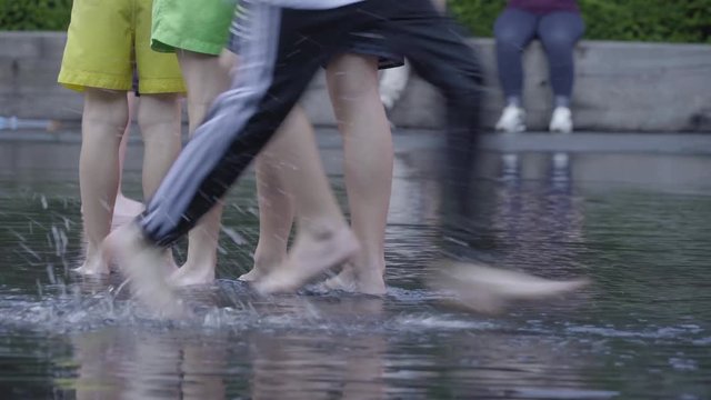 Children Playing In Water