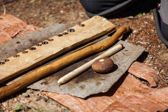 Hand drill campfire lighting kit during native arts workshop explaining how to light a fire with primitive tools - Closeup picture of the tools displayed on the ground