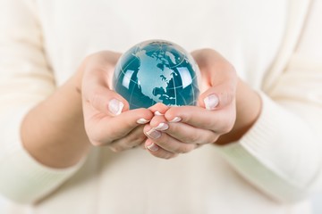 Small globe held by a person