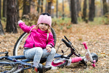 Adorable girl riding a bike
