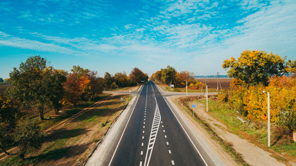 Aerial view of the new road in Ukraine. Autumn. Road marking.