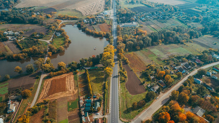 Fototapeta premium Aerial view of the new road in Ukraine. Autumn. Road marking.