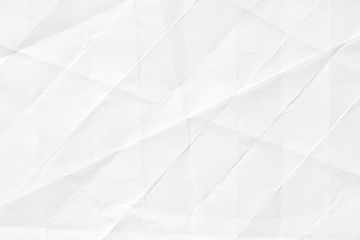 The texture of white paper with kinks. Background of crumpled cardboard.