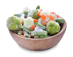 Bowl with frozen vegetables on white background