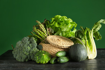 Various fresh vegetables on dark wooden table