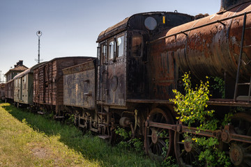 Old steam locomotive with old wagons connected