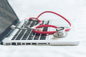 stethoscope on laptop keyboard
