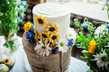 wedding cake on rustic wood stand