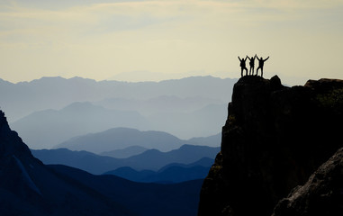 successful climbers, mountain range and spectacular depth - obrazy, fototapety, plakaty