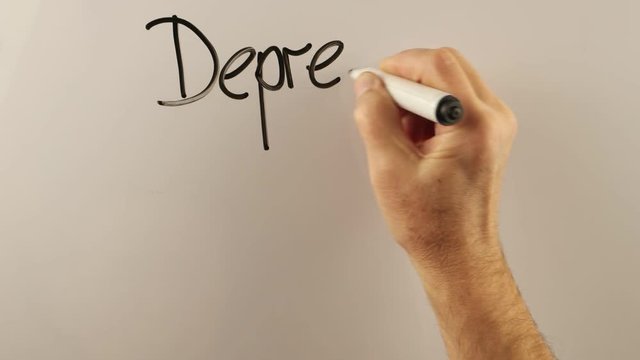 Man explains link between depression and stress on a whiteboard