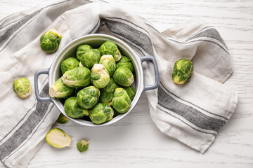 Casserole with fresh brussels sprouts on table, top view