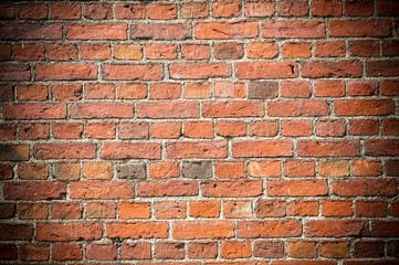 Fototapeta premium red brick wall with vignetted corners