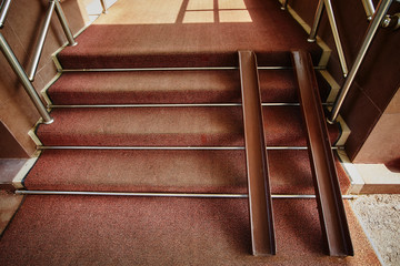Metal rails for wheelchairs in the doorway of the store. Ramp for accessibility of a person with...