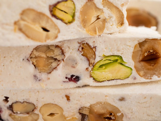 Nougat on white background. Copy space. Christmas sweet.